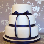 Basic cake with blue ribbon accent
